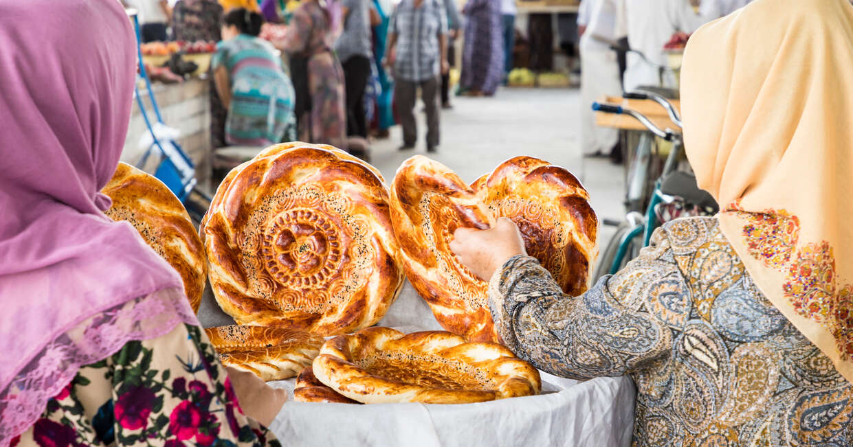 Local women shopping for traditional Uzbek bread